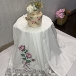 White seersucker rida with cross stitch rose